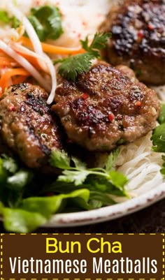 some meatballs and vegetables are on a white plate with noodles, coleslaw and carrots