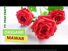 three red roses sitting next to each other on top of a white surface with the words origami mawar written below it