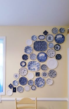 a dining room with plates on the wall