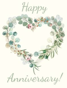 a heart shaped wreath with the words happy anniversary written in green leaves and pink flowers