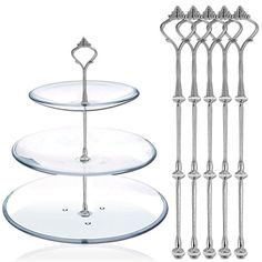 three tiered glass cake plate with metal handles and two serving trays on each side