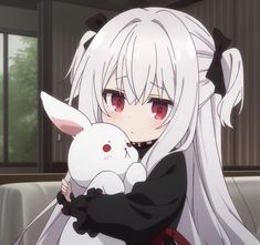 a girl with long white hair holding a stuffed animal