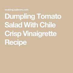 dumpling tomato salad with chile crisp vinaigrete recipe on the side is shown