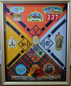 a framed photo with patches and badges on it