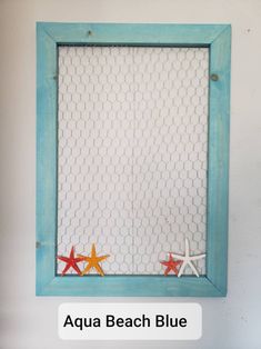 an aqua beach blue frame with two starfishs