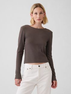 Soft, stretch cotton-modal blend ribbed T-shirt.  Crewneck.  Long sleeves.  Fit: Stretch-to-Fit.  Slim & stretchy that forms to your shape.  Hits at the waist.  Models wearing Gap Cropped Shirts, Brand Collaboration, Cropped T Shirt, Clothing Essentials, Crop Tshirt, Crop Shirt, Stretch Cotton, Gap, Long Sleeves