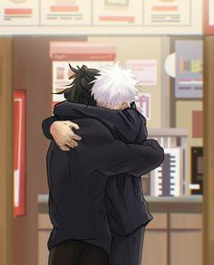 two people hugging each other in an office