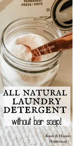 a jar filled with laundry detergent next to a paper towel