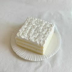 a piece of cake sitting on top of a paper plate