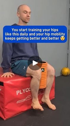 a man sitting on top of a red box next to an orange object with the caption, you start training your hips like this daily and your hips keep getting better and