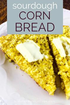 a close up of a piece of corn bread on a plate with sourdough