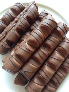 several pieces of chocolate on a white plate