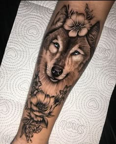 a wolf with flowers on his leg