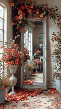 a large mirror sitting in the middle of a room filled with flowers