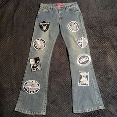 Blue Denim Bootcut Jeans By Le More With All Over Appliques Of Embroidered Grayscale Football-Themed Patches. Tagged Size 11. See Measurements For A Good Fit: Waist = 32", Inseam = 33.5, Rise = 9". Excellent Used Condition. See Photos For Details. Please Comment Below With Any Questions. *Many Of Our Items Come From Estate Sales Or Other Sources, Which Means We Do Not Know Their History. We Do Not Automatically Launder Or Clean Items That Are Vintage Because We Do Not Want To Damage Them. We Als Ariat Jeans, Denim Bootcut Jeans, Bootleg Jeans, Patch Jeans, Retro Fits, Denim Patches, Patched Jeans, How To Stretch Boots, Curvy Jeans