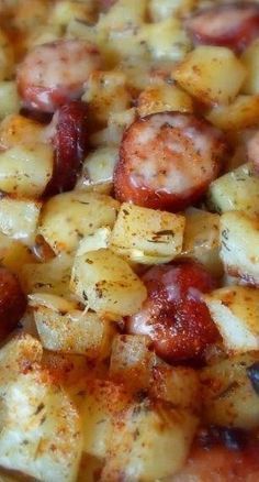 there is a pizza with sausage and potatoes on it