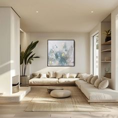 a living room filled with lots of white furniture