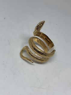 Vintage Gothic Golden Stainless Steel Snake Ring Cool Vintage Rock and Roll star men's ring Nice heavy ring, Stainless Steel Unused stock from the 1980's I have ONLY 7- 13 Adjusts as well. Please add your size to the order in a message and I will send the size you require. If I am out of stock in your size, I will list the ones I have available for replacement. If I am sold out in the sizes you would prefer, I will cancel and refund you, Thank you All jewelry is shipped in a nice gift box. Check Adjustable Gold Metal Snake Ring, Elegant Snake-shaped Metal Rings, Elegant Snake Shaped Metal Rings, Elegant Metal Ring In Snake Shape, Adjustable Gold Snake Ring, Gold Snake Ring As Gift, Elegant Gold Snake Ring, Luxury Snake Ring As A Gift, Serpent Ring