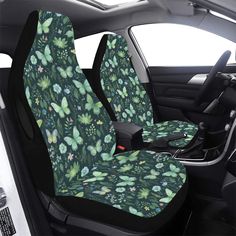 a car seat cover with butterflies and flowers all over it, sitting in the passenger's side