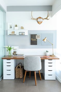 a white desk with drawers and a chair in front of it on the internet page