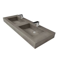 an image of two sinks in the middle of a counter top that is made out of concrete