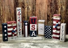 wooden blocks decorated with american flags and the word usa written in red, white, and blue