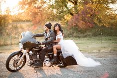 a bride and groom are sitting on a motorcycle