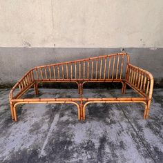 a bamboo bed frame sitting on the ground