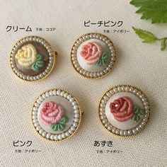 four different types of buttons with flowers on them