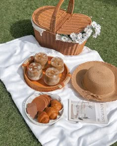 the picnic is set out on the grass and ready to be eaten