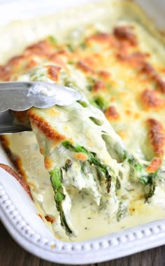 a close up of a casserole with broccoli and cheese on it