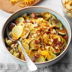 a bowl filled with cooked vegetables and cheese