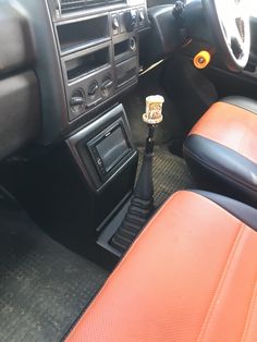 the interior of a car with an automatic radio and dash board, steering wheel and dashboard controls