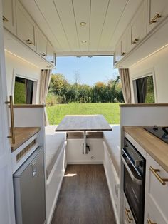 the inside of a camper with an open kitchen