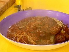 a purple bowl filled with meat and noodles