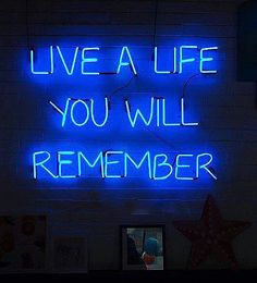 a neon sign that says live a life you will remember