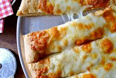 two slices of cheese pizza on a plate