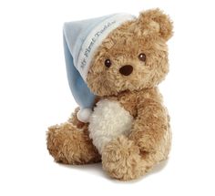 a brown teddy bear wearing a blue and white hat