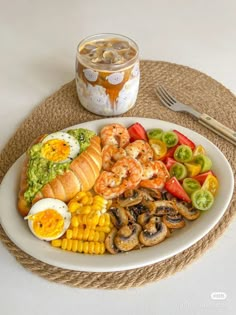 a white plate topped with food next to a fork