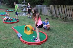 children playing mini golf in the back yard