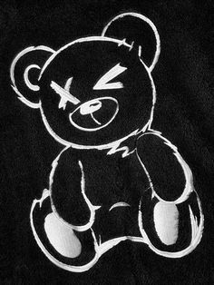 a black and white photo of a teddy bear drawn in chalk on a t - shirt