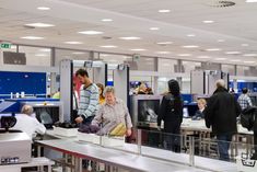 people are standing in line at an airport