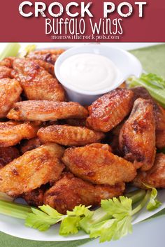 chicken wings with ranch dressing on the side and lettuce in the foreground