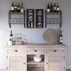 a wooden cabinet with wine glasses and bottles on the wall above it, along with two chalkboard menus