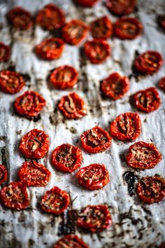 tomatoes on a baking sheet ready to be cooked