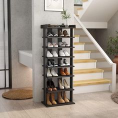 the shoe rack is next to stairs and a potted plant