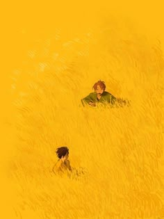 two people are in the tall grass looking at something