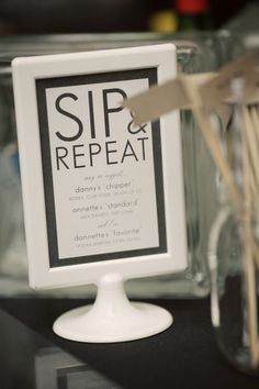 there is a sign that says sip and repeat