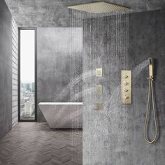 a bathroom with a bathtub, shower head and hand held shower faucet