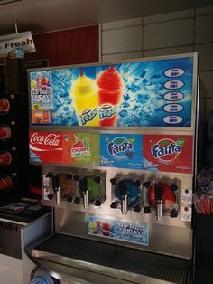 an ice cream machine is shown with sodas on the front and pepsi cola on the back